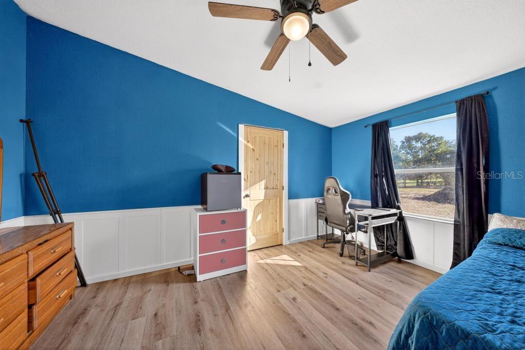 40100 Jim Scotts Road Leesburg, FL 34788 - Photo 28 of 40 a view of workspace with wooden floor and windows