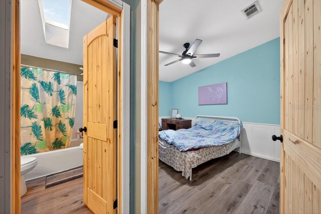 40100 Jim Scotts Road Leesburg, FL 34788 - Photo 29 of 40 a bedroom with a bed and a window