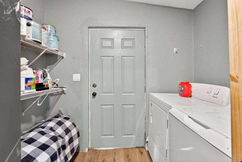 40100 Jim Scotts Road Leesburg, FL 34788 - Photo 32 of 40 a storage room with washer and dryer