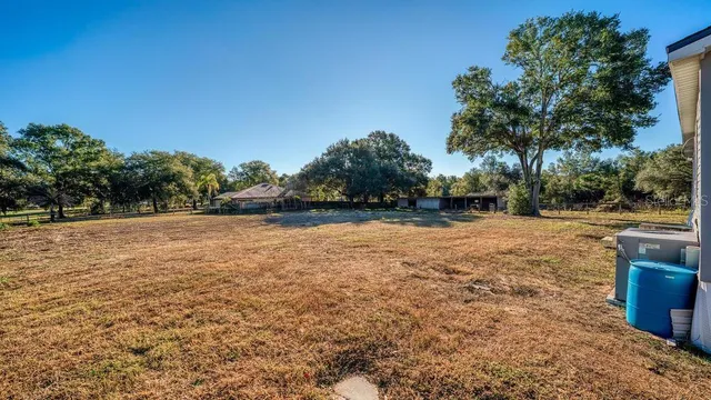 a view of backyard with outdoor space