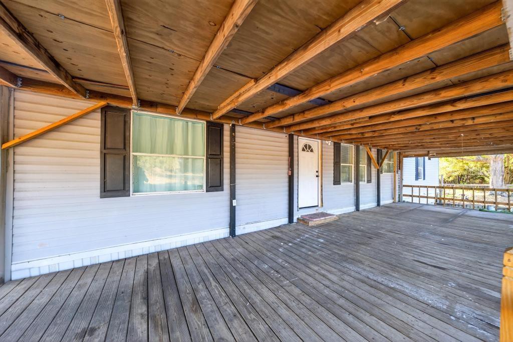 40100 Jim Scotts Road Leesburg, FL 34788 - Photo 4 of 40 a view of empty room with wooden floor