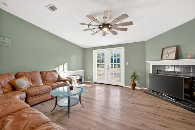 a living room with furniture and a fireplace