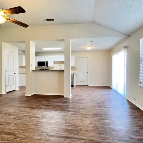 a view of kitchen with wooden floor