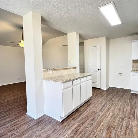 a view of bathroom with wooden floor