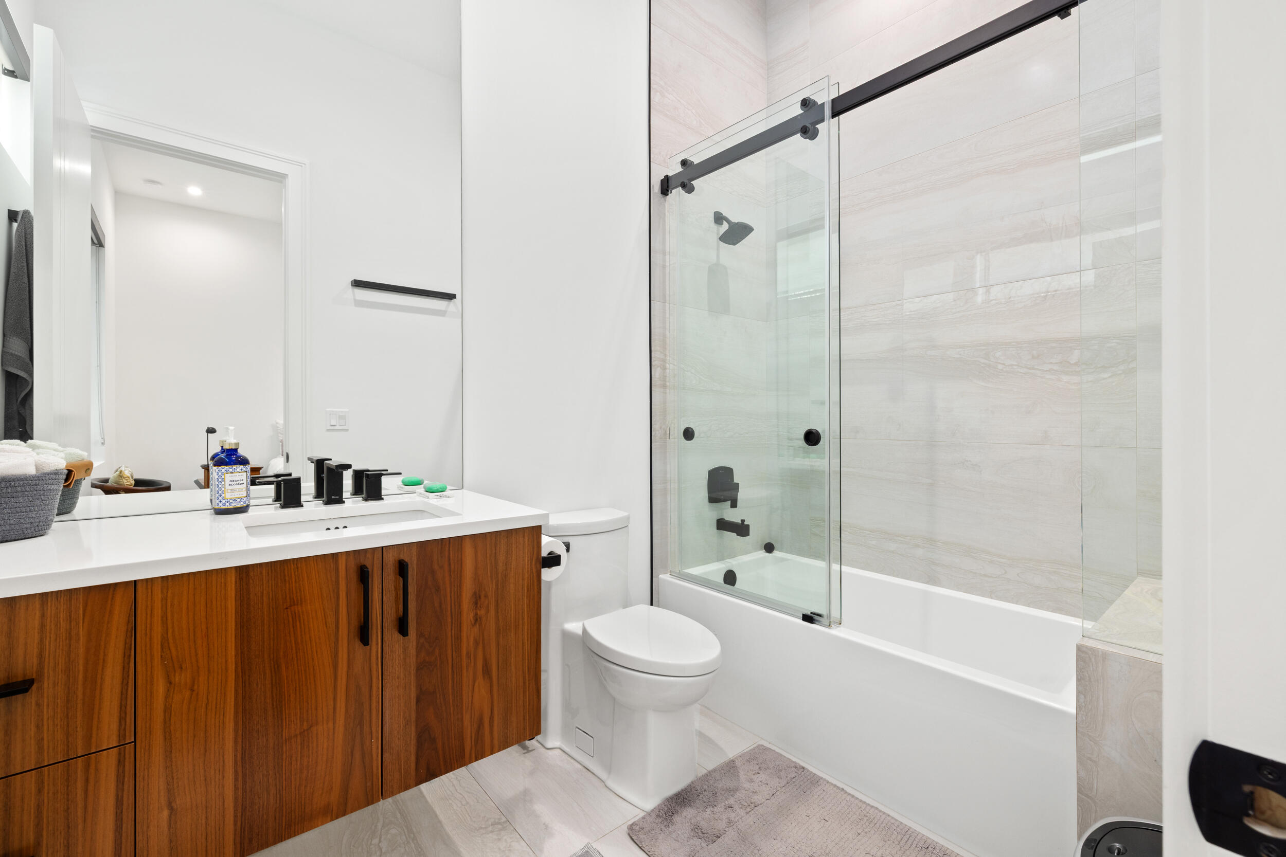 10 Coconut Road Delray Beach, FL 33444 - Photo 19 of 41 a bathroom with a sink toilet tub and shower