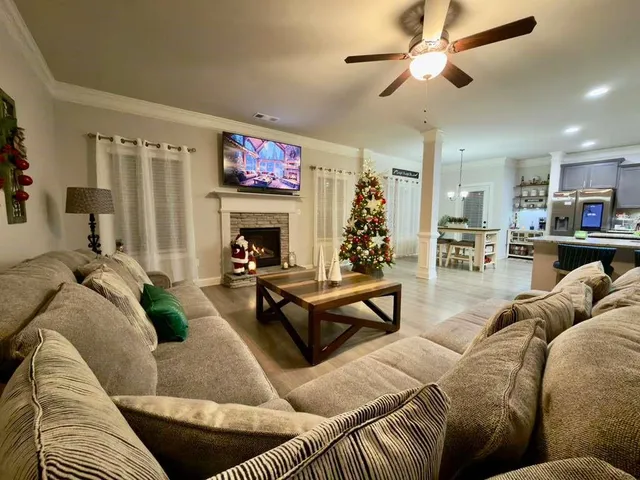 a living room with furniture and a fireplace