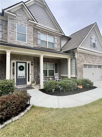 front view of a house with a yard