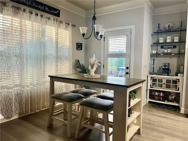 a kitchen with a table and chairs in it