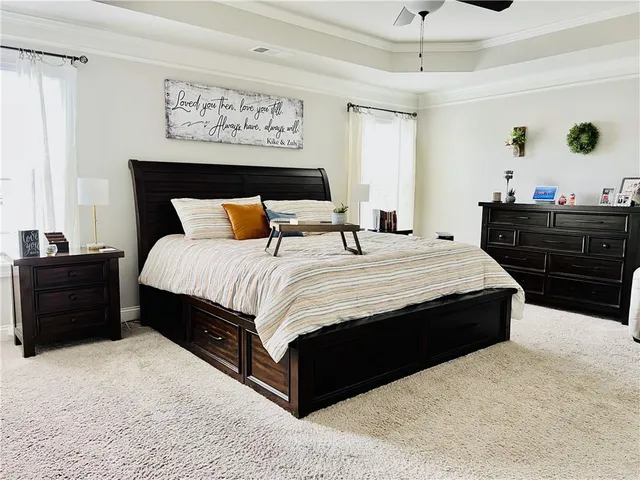a bedroom with a bed and a dresser