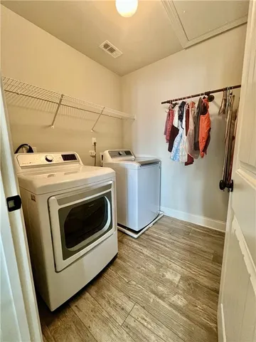 a utility room with dryer and washer
