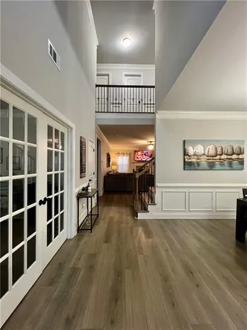 a view of a living room and a wooden floor