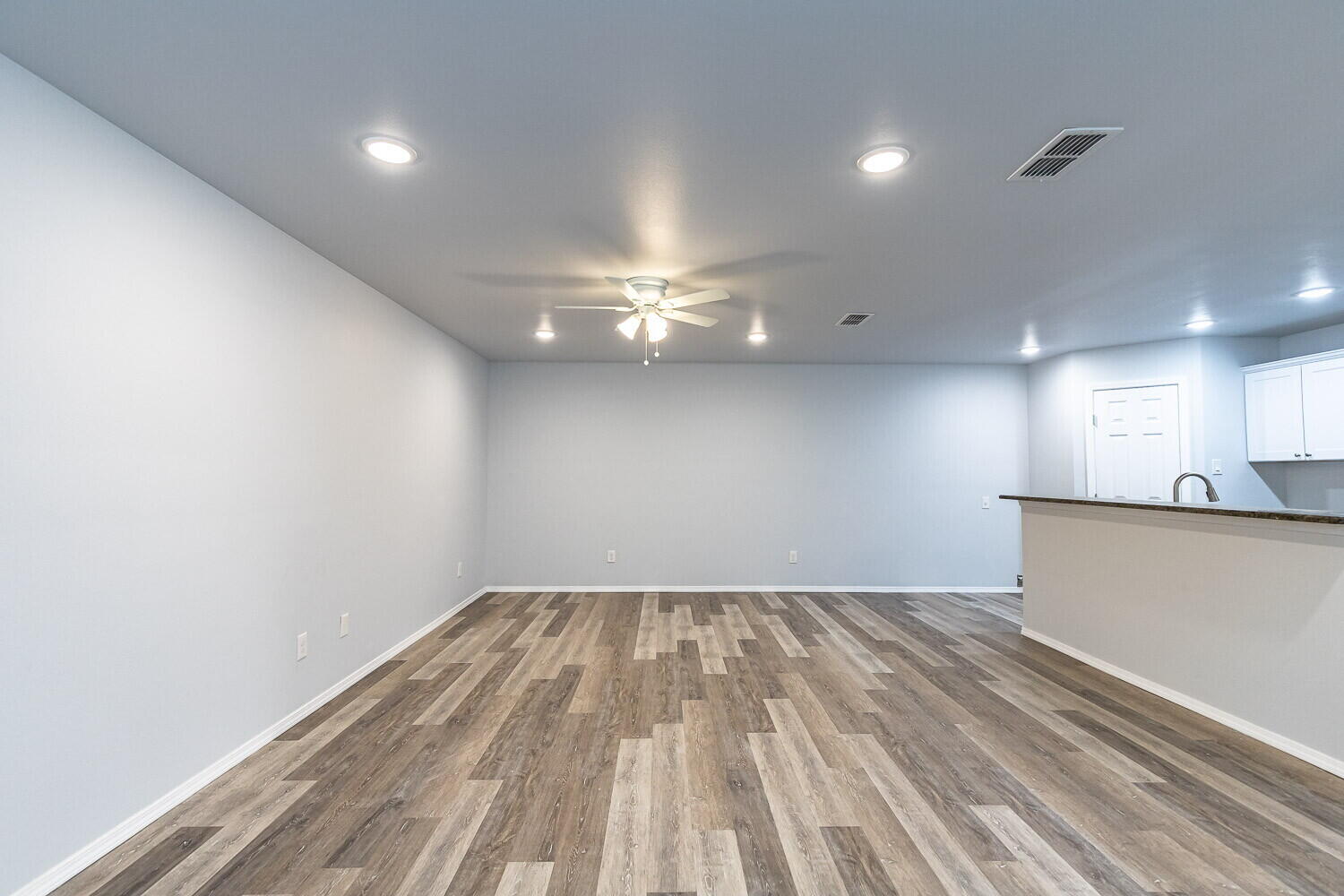 1104 North Englewood Avenue, Unit B Lubbock, TX 79416 - Photo 3 of 11 a view of empty room with wooden floor