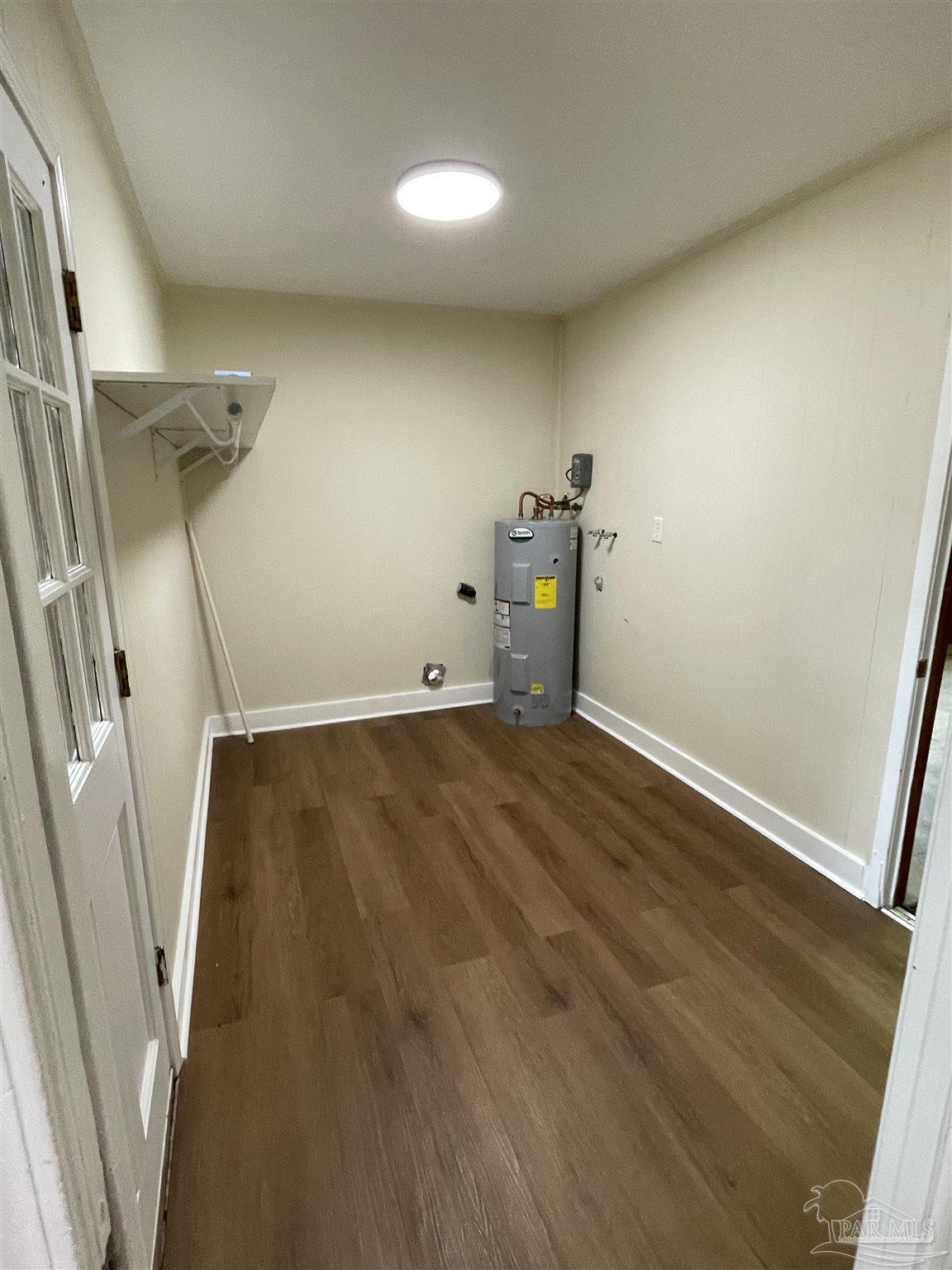 4140 April Road Pensacola, FL 32504 - Photo 11 of 12 a view of empty room with wooden floor