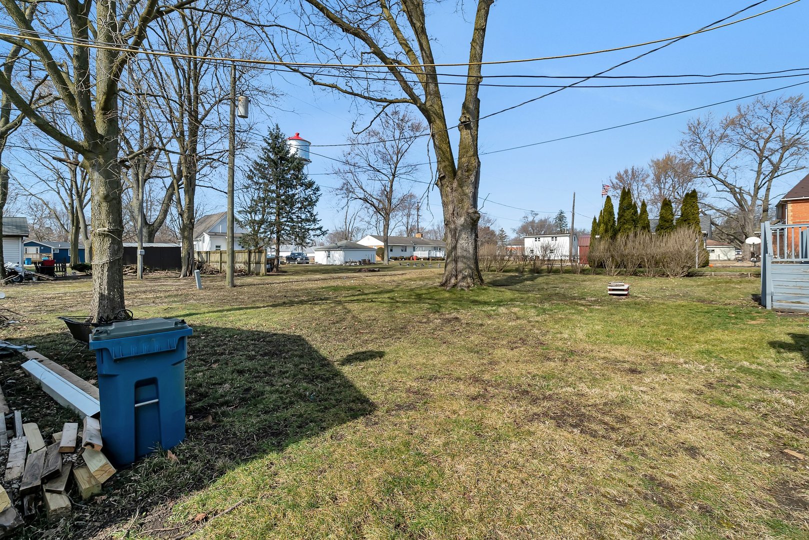 401 7th Street Mazon, IL 60444 - Photo 23 of 26 a backyard of apartments with large trees