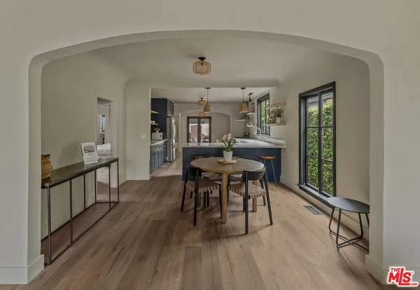 a view of a dining room with furniture and window