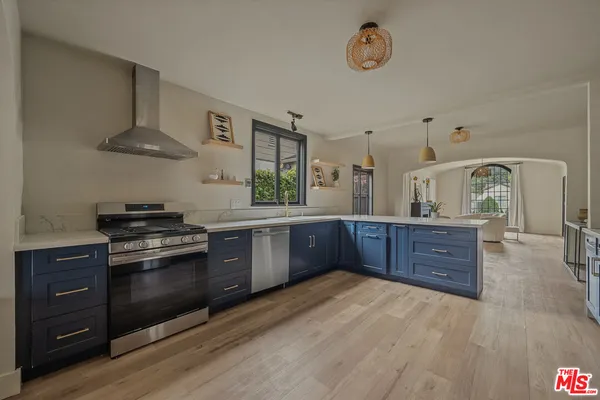 a kitchen with a refrigerator and a sink