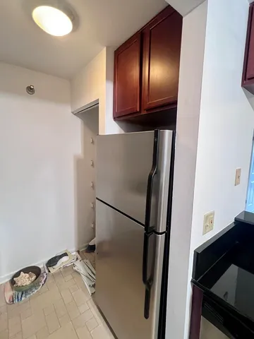 a view of a wooden chairs in a balcony