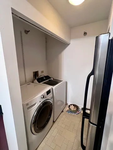 a bathroom with a sink a toilet a mirror and bathtub