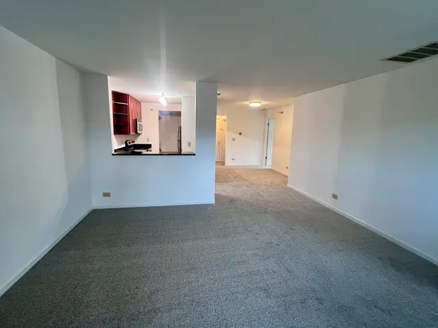 a view of a kitchen with a sink