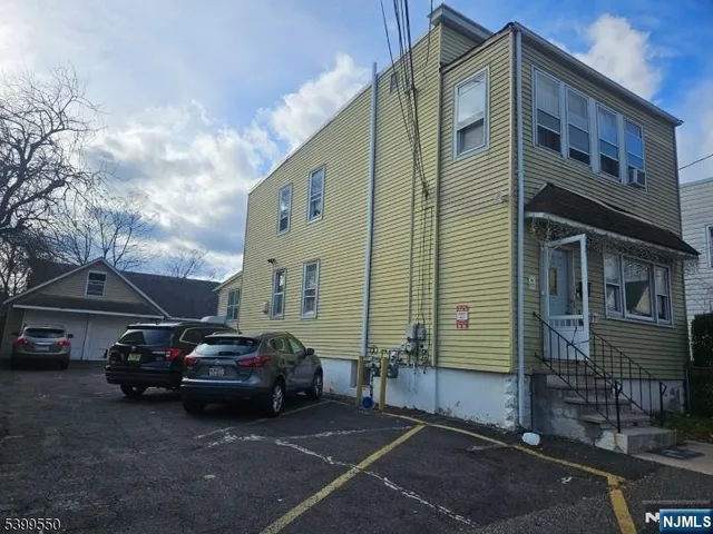 a view of a car parked in front of a building