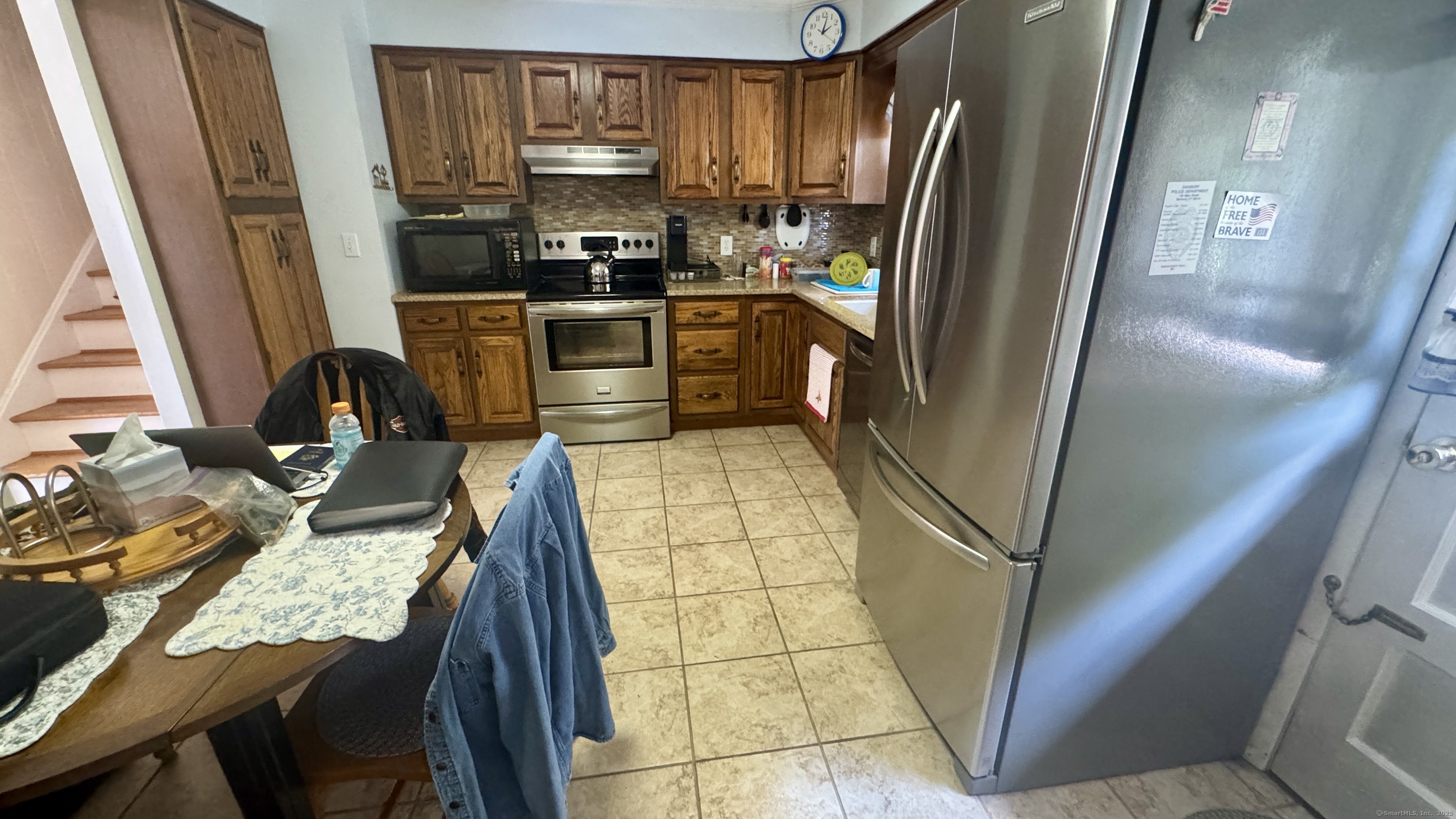 30 Mountain Road Danbury, CT 06810 - Photo 11 of 35 a kitchen with granite countertop a refrigerator a stove a sink and dishwasher