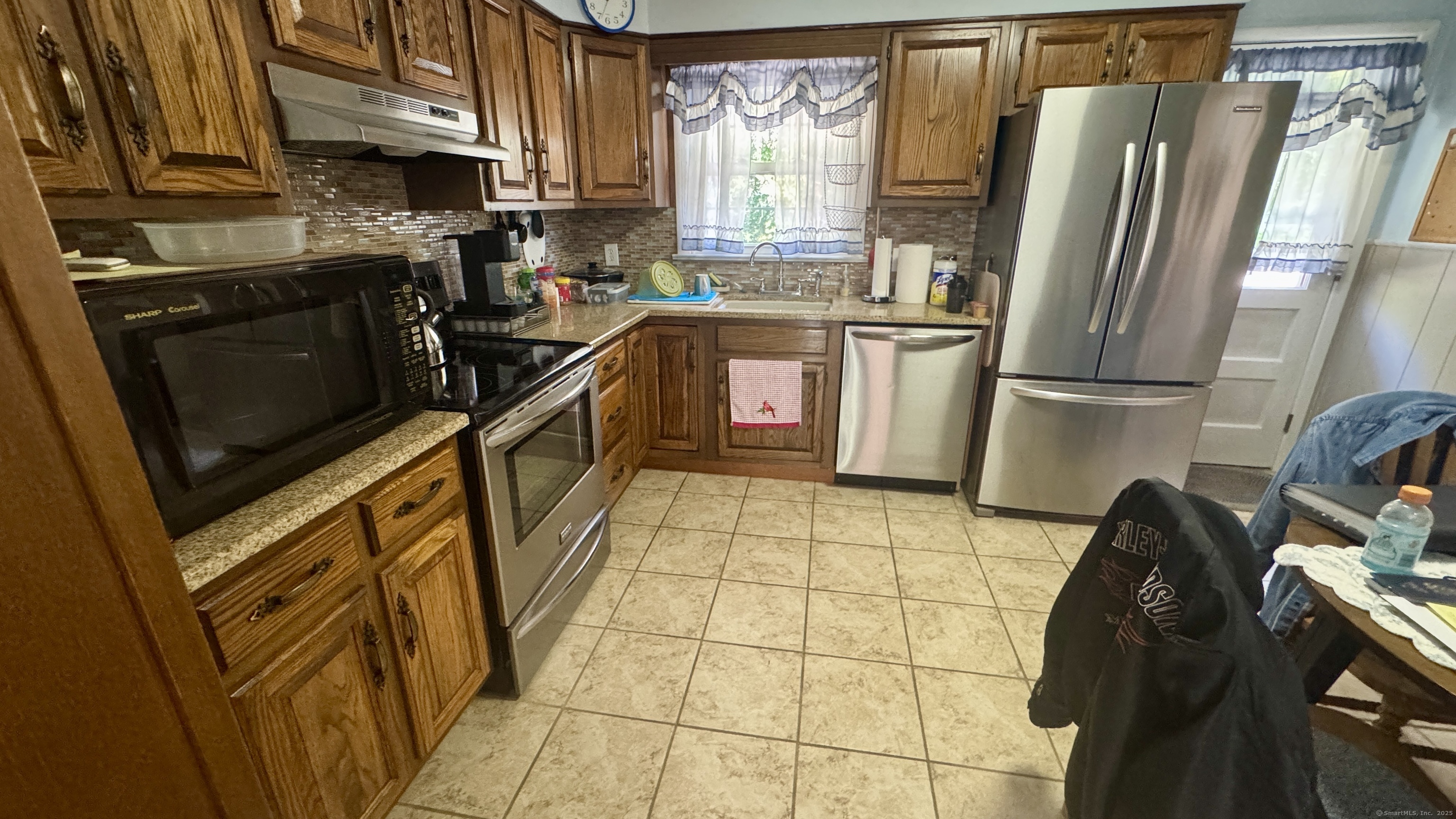 30 Mountain Road Danbury, CT 06810 - Photo 12 of 35 a kitchen with stainless steel appliances a refrigerator sink and wooden cabinets