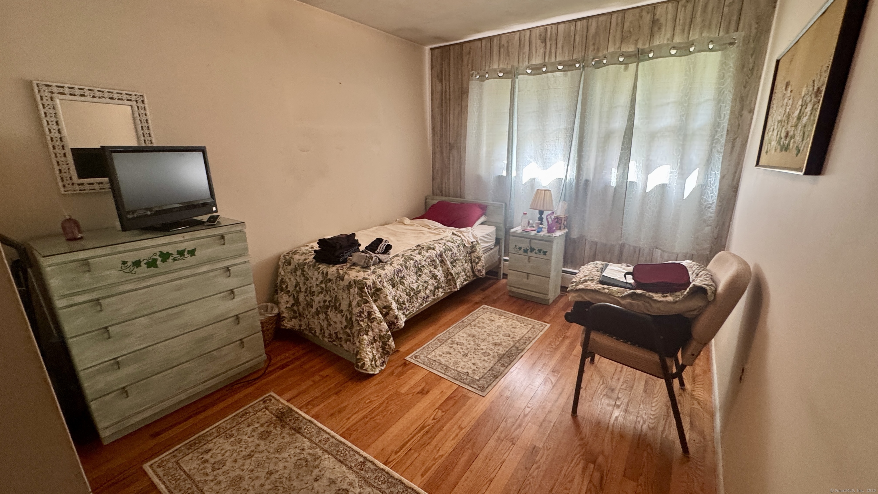 30 Mountain Road Danbury, CT 06810 - Photo 15 of 35 a bedroom with furniture and a flat screen tv