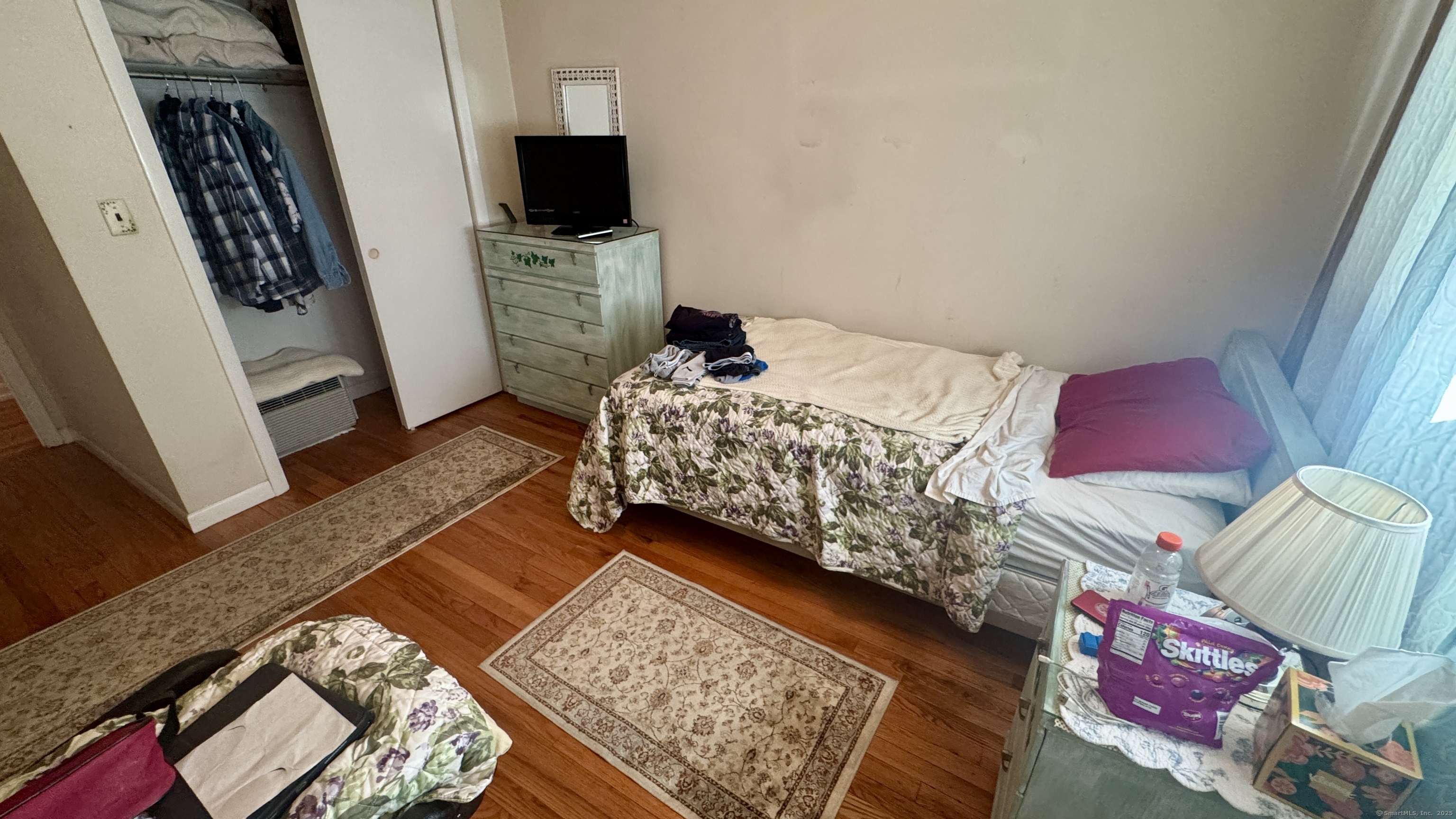 30 Mountain Road Danbury, CT 06810 - Photo 16 of 35 a bedroom with a bed and flat screen tv