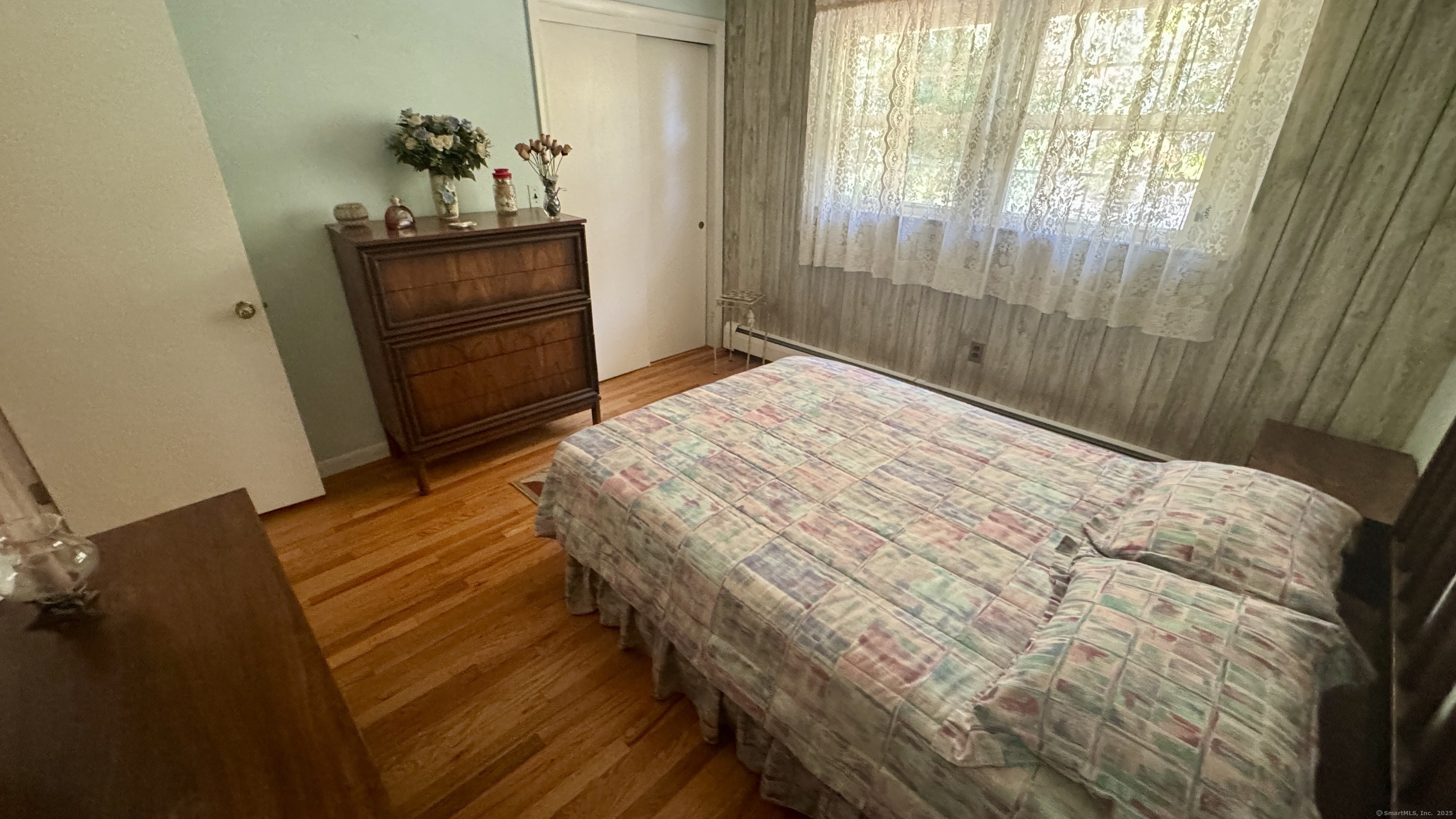 30 Mountain Road Danbury, CT 06810 - Photo 18 of 35 a bedroom with a bed and wooden floor