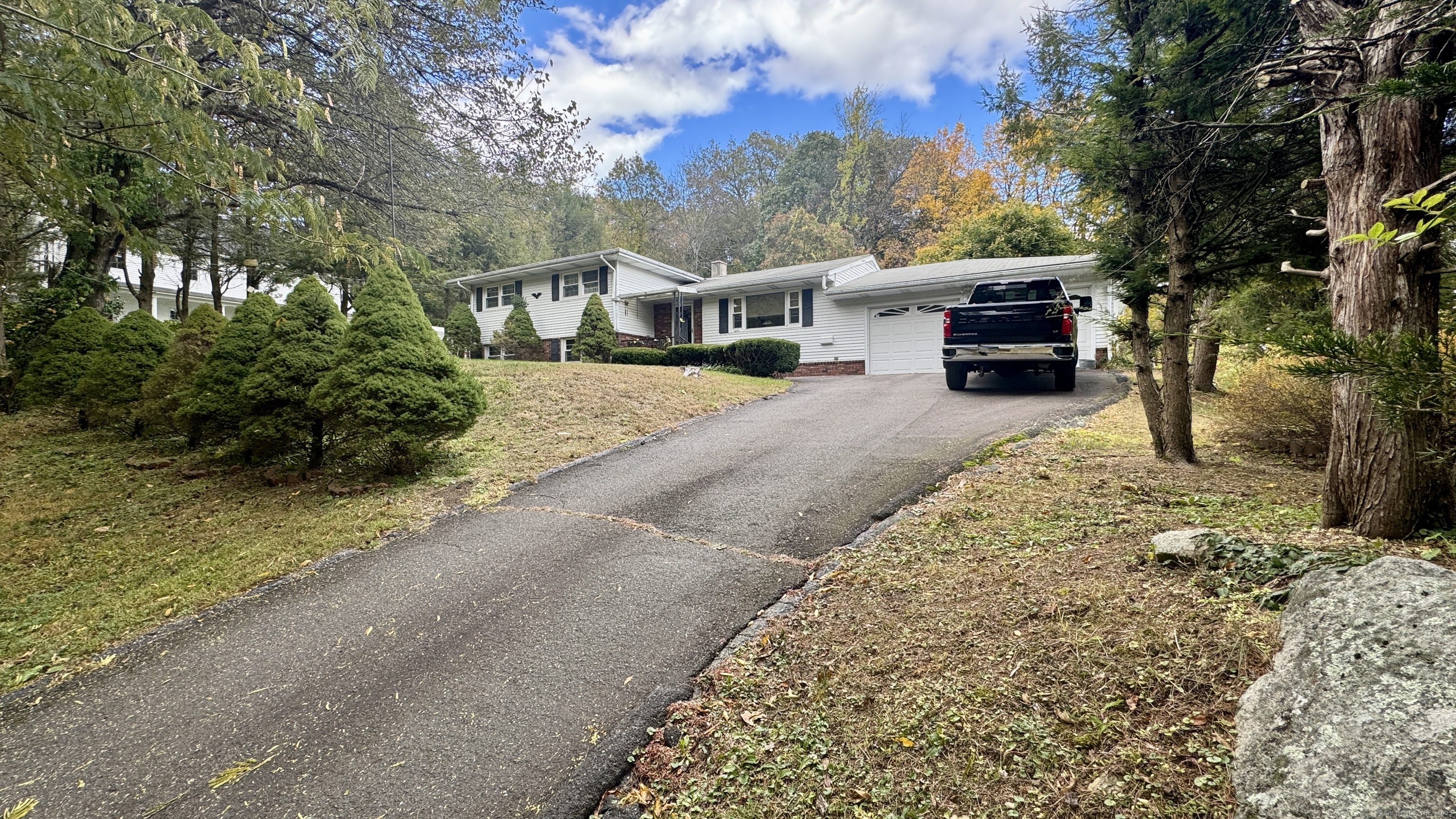 30 Mountain Road Danbury, CT 06810 - Photo 7 of 35 a view of house with outdoor space and car parked