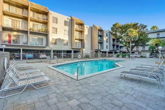 a view of a swimming pool with a lounge chairs