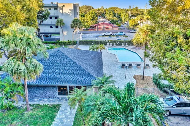 an aerial view of a house with a garden and plants