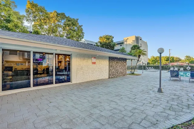 a view of a house with a backyard and garage