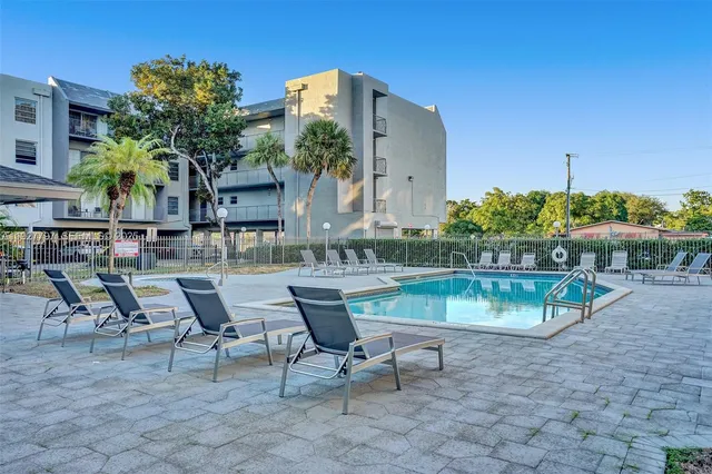 a view of a chairs and table in patio