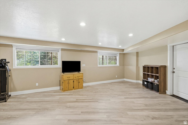 353 Robin Street Smithfield, UT 84335 - Photo 35 of 70 Unfurnished living room with light wood finished floors, plenty of natural light, and recessed lighting