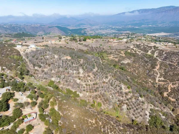 a view of a dry with mountains in the background