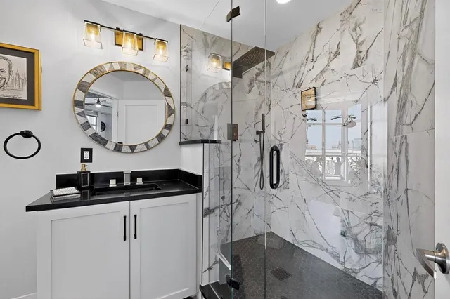 a bathroom with a sink and a mirror