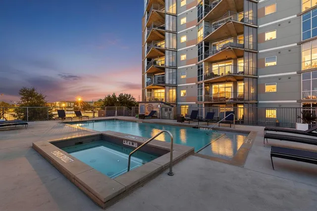a view of a swimming pool with a lounge chair