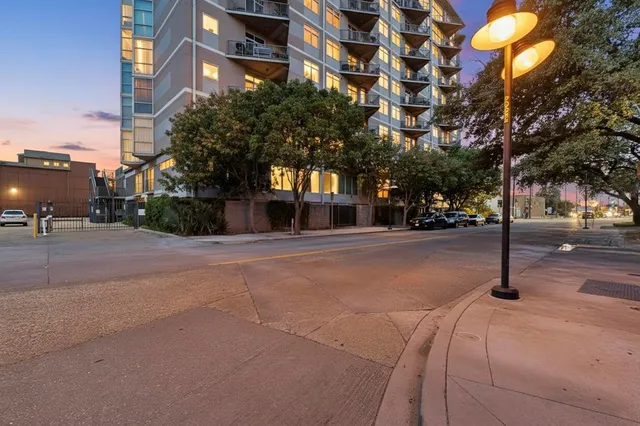 a front view of a building with trees