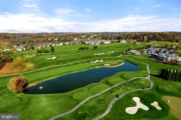 an aerial view of a golf course with swimming pool