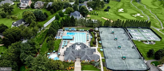a view of a backyard with swimming pool