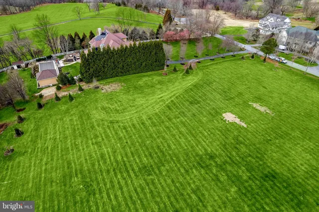 a view of a garden with a building in the background