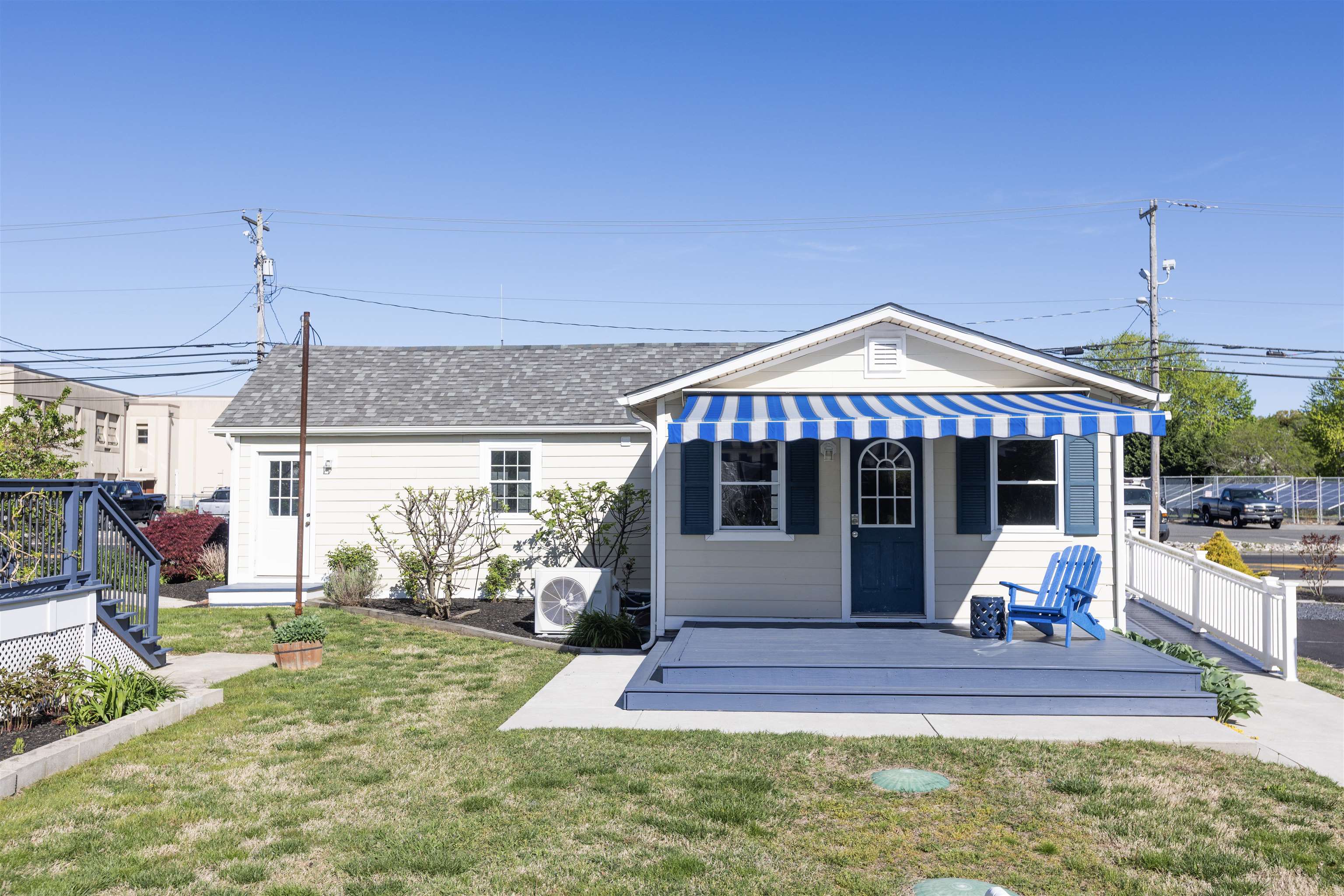 837 Seashore Road Cape May, NJ 08204 - Photo 20 of 47 a front view of a house with a yard table and chairs