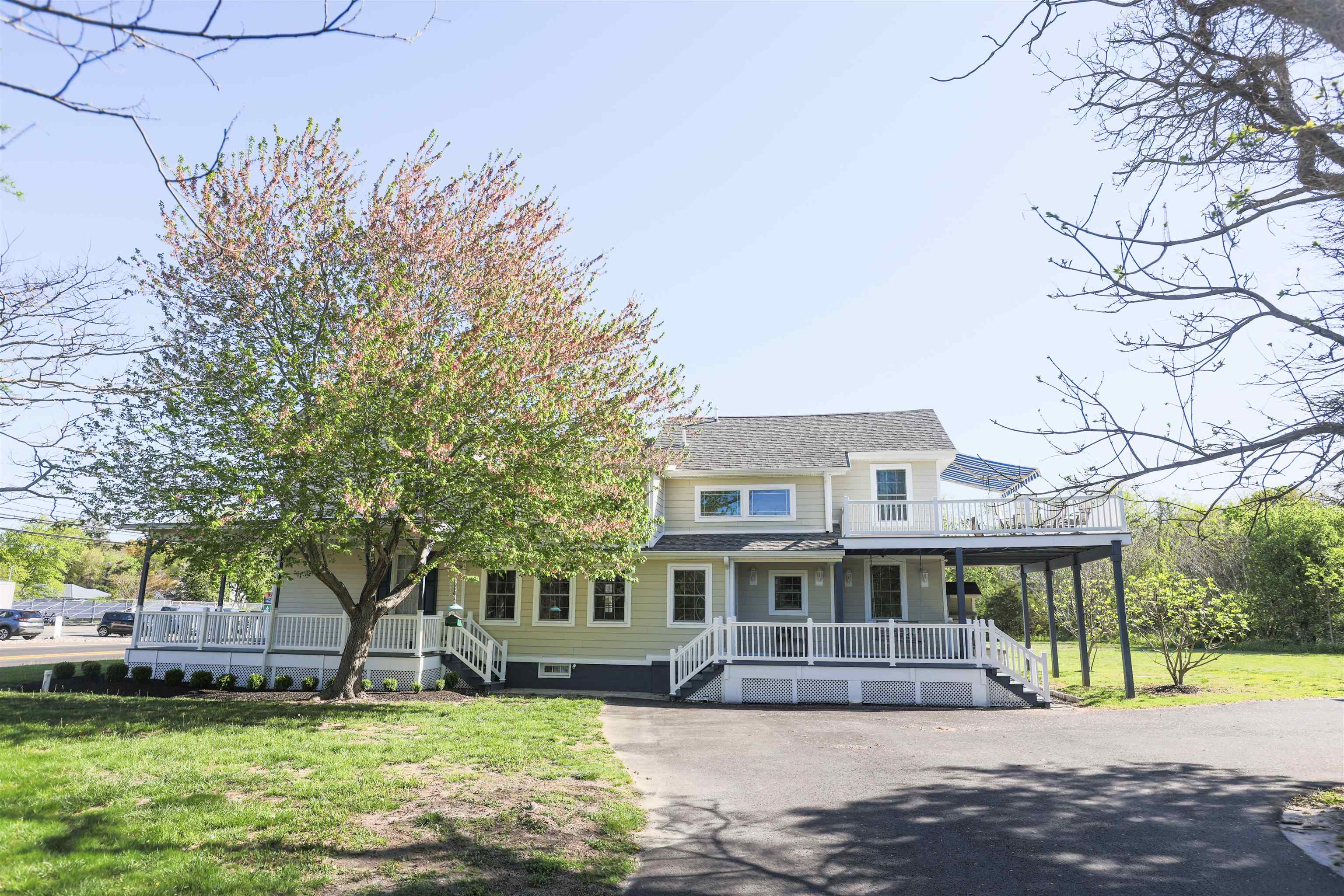 837 Seashore Road Cape May, NJ 08204 - Photo 3 of 47 a front view of a house with a yard