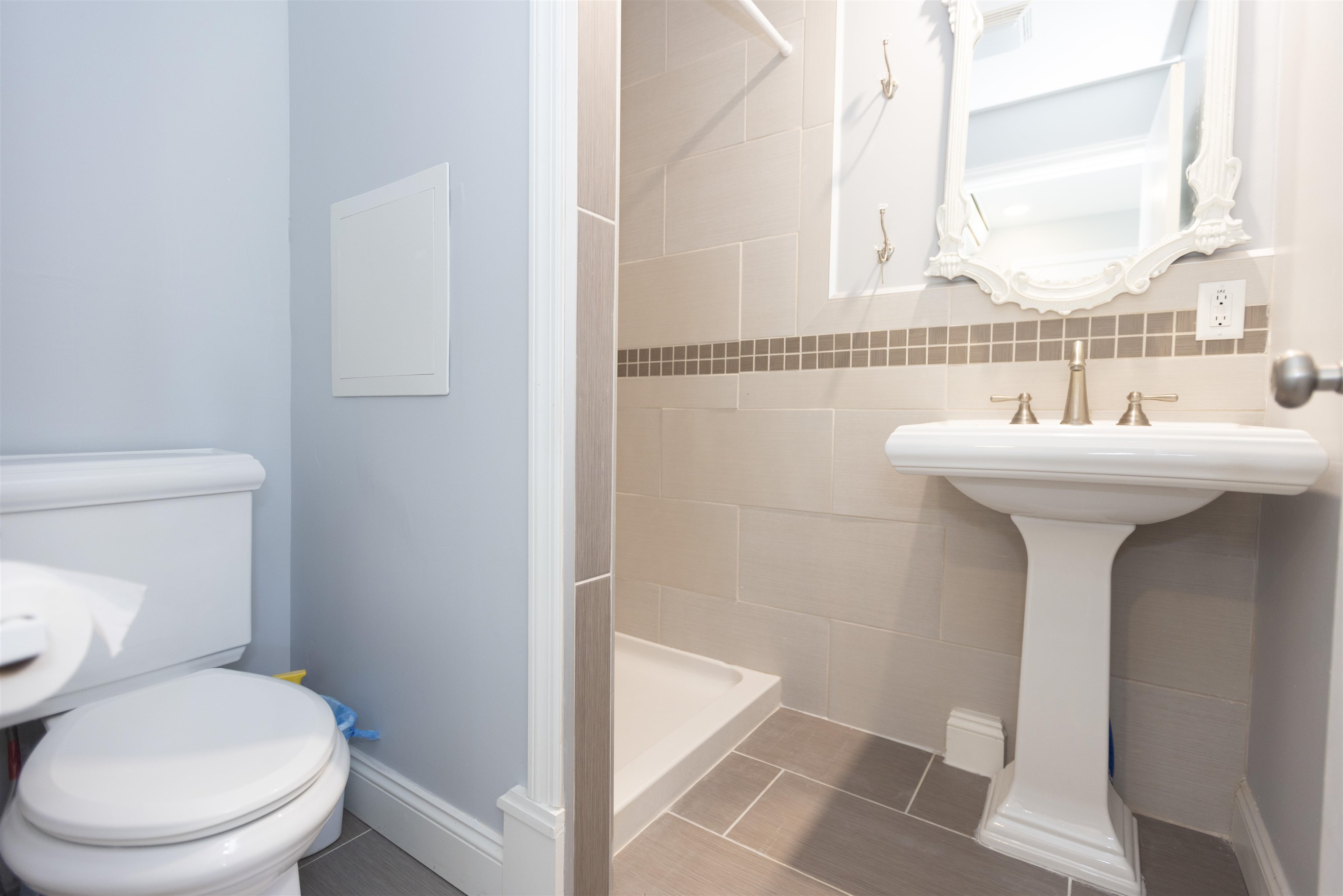 837 Seashore Road Cape May, NJ 08204 - Photo 41 of 47 a bathroom with a sink a toilet and a mirror