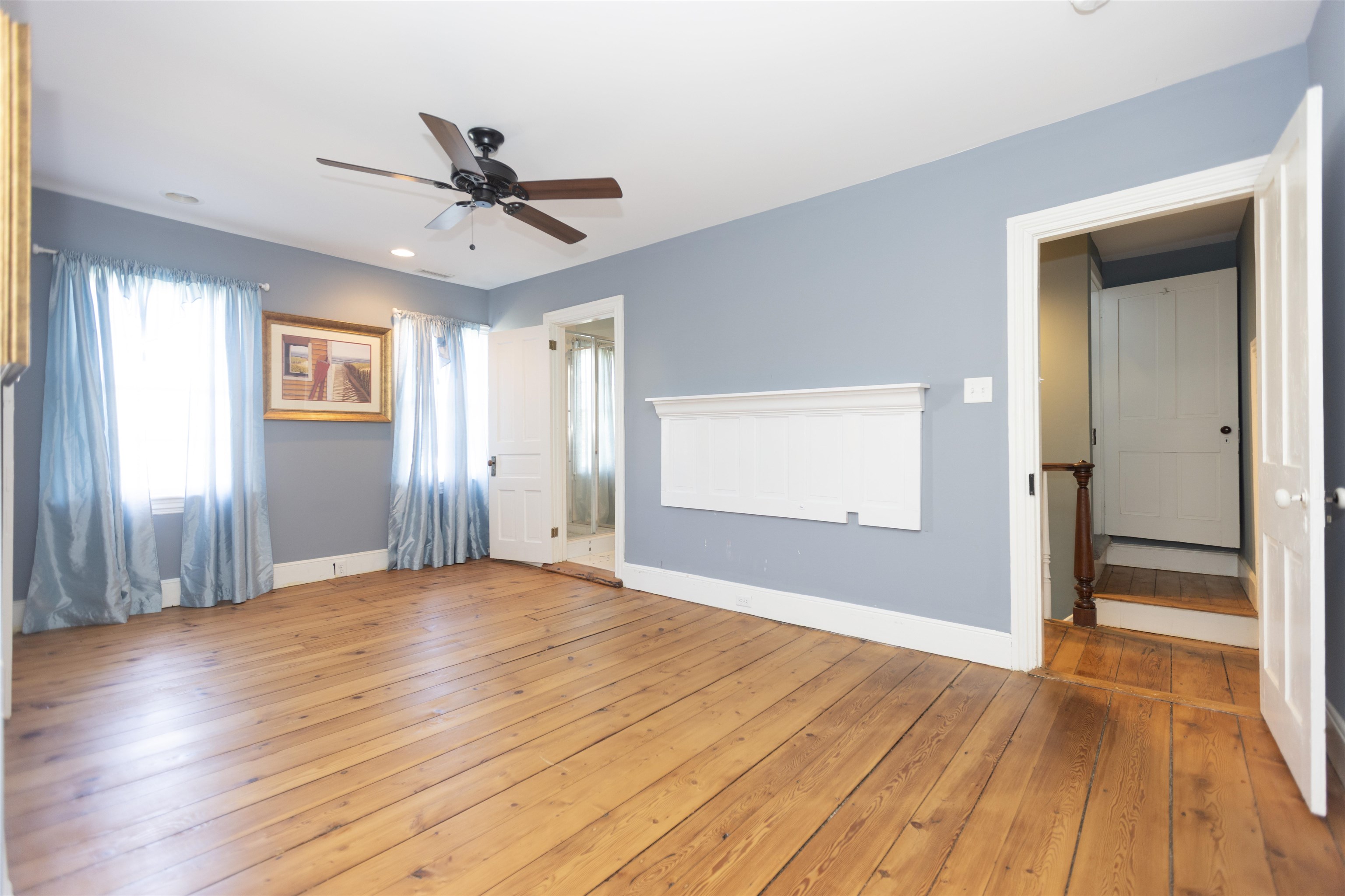 837 Seashore Road Cape May, NJ 08204 - Photo 7 of 47 a view of an empty room with wooden floor and a window