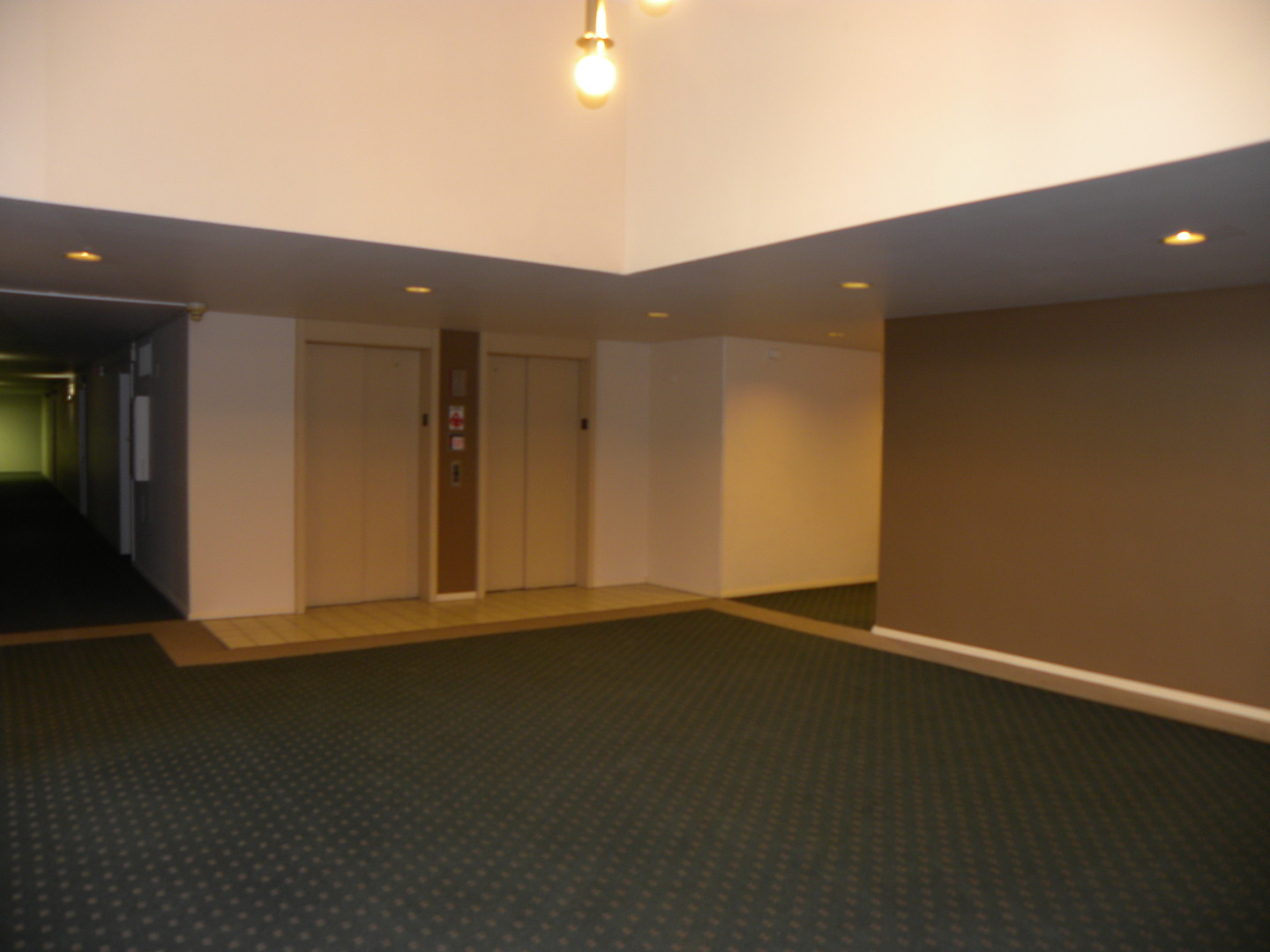 1931 Prairie Square, Unit 308 Schaumburg, IL 60173 - Photo 3 of 11 an empty room with wooden floor and windows