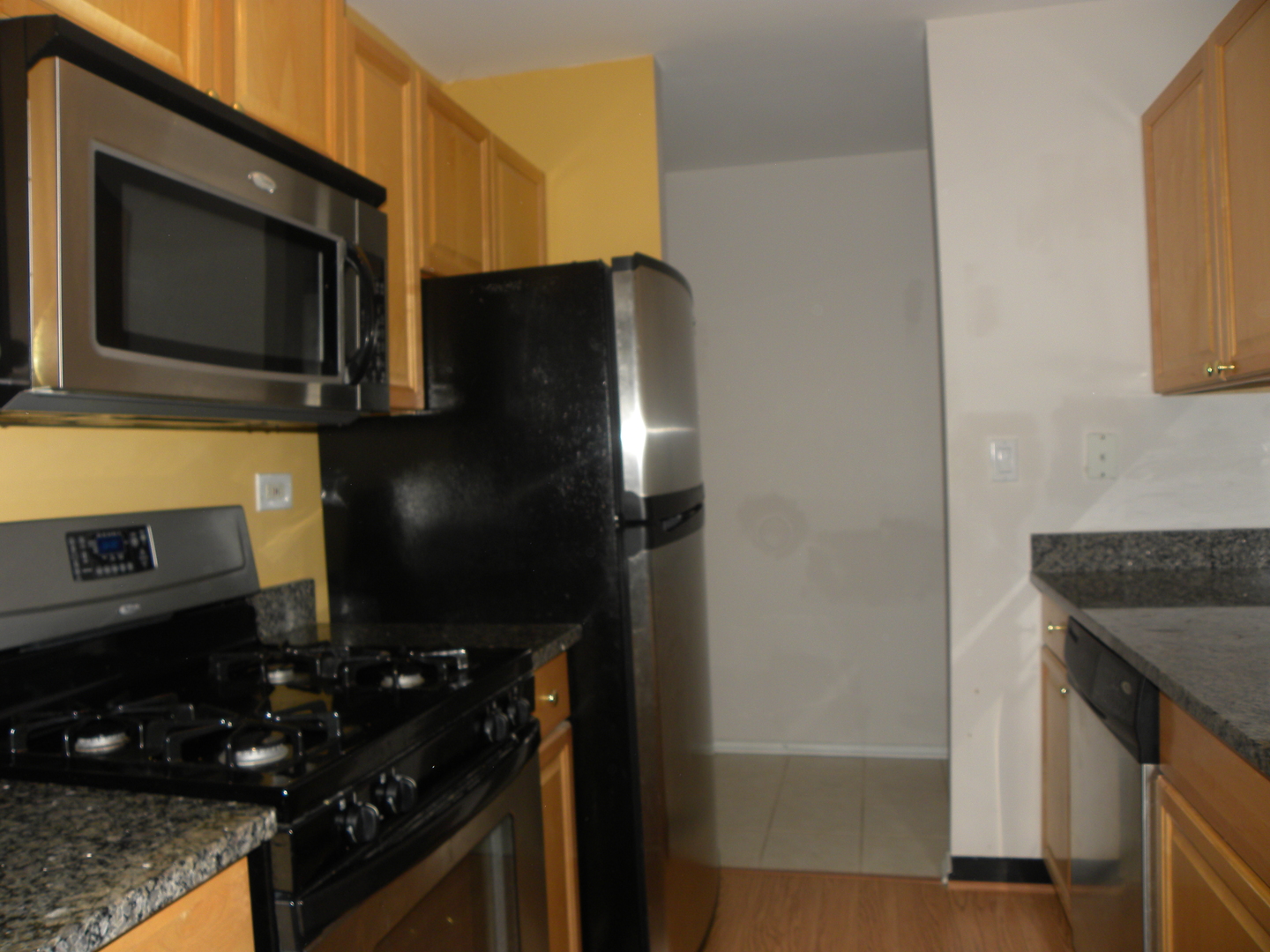 1931 Prairie Square, Unit 308 Schaumburg, IL 60173 - Photo 7 of 11 a kitchen with a sink and a stove top oven