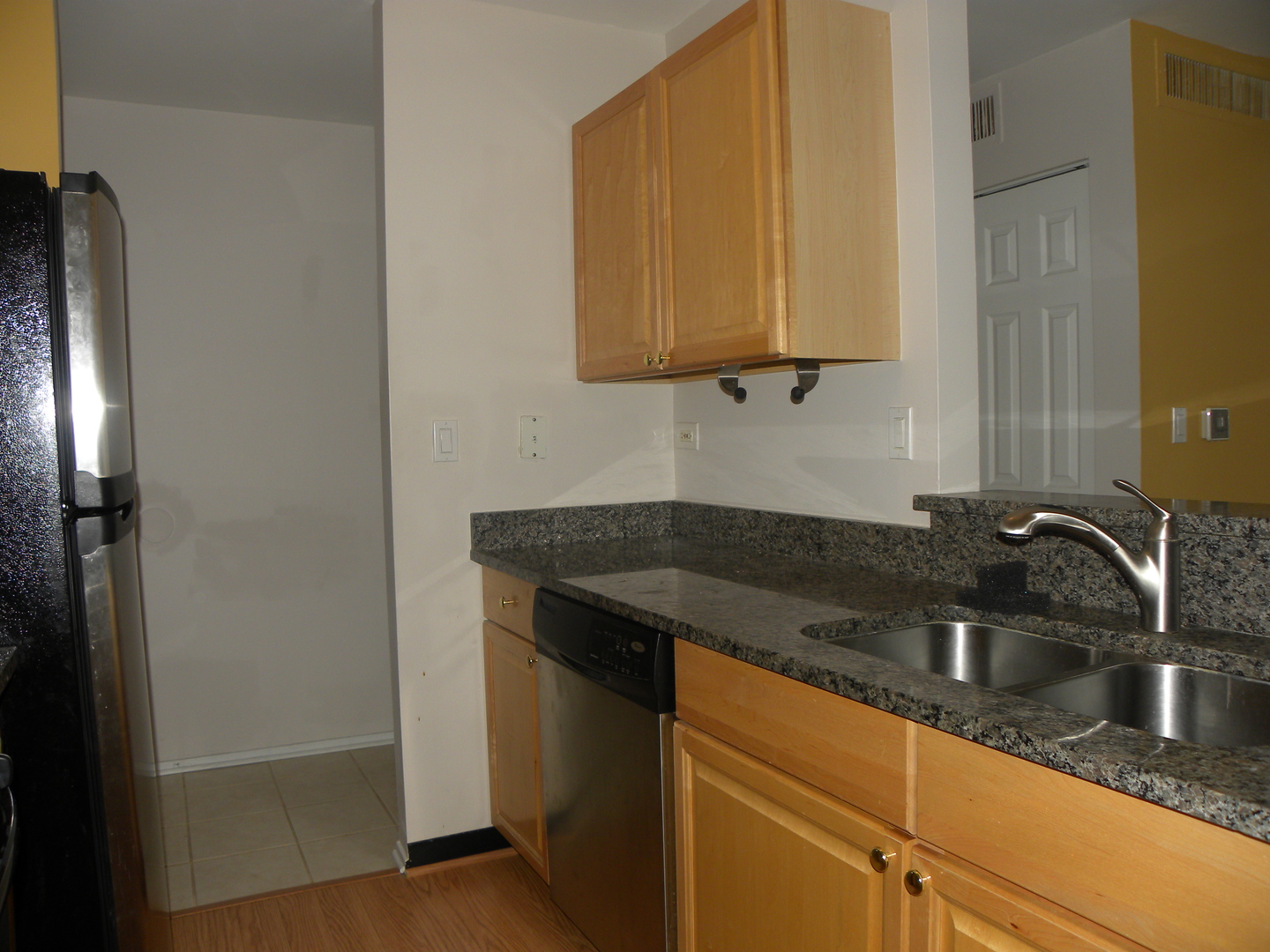 1931 Prairie Square, Unit 308 Schaumburg, IL 60173 - Photo 8 of 11 a kitchen with granite countertop a sink and cabinets