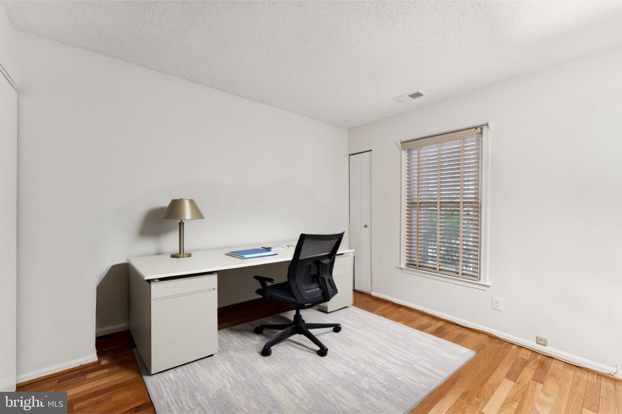 3152 B Covewood Court Falls Church, VA 22042 - Photo 11 of 26 a view of a workspace with furniture and a window